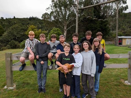 City on a Hill youth group posing together on grass